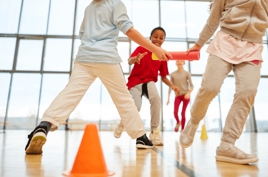 Kids playing a group game during PE class